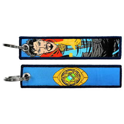 Two embroidered key fobs featuring marvel doctor strange with comic portrait and infinity gauntlet key tag design