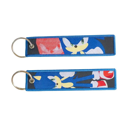 Blue embroidered key fob featuring sonic the hedgehog in dynamic poses with metallic ring keychain key tag
