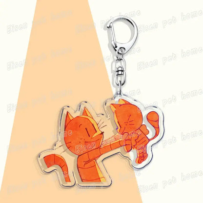 Orange printed acrylic dog acrylic keychain featuring two cartoon cats in a playful embrace cute bag charm