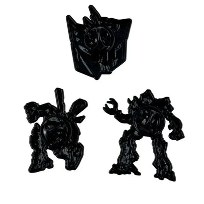 Black enamel pin set featuring three distinct transformers characters with glossy finish and detailed sculpted designs