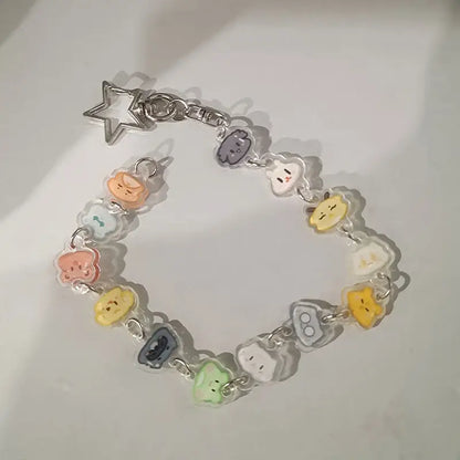 Anime charm bracelet keychain with translucent pastel cartoon pendants and a silver beaded star pendant clasp