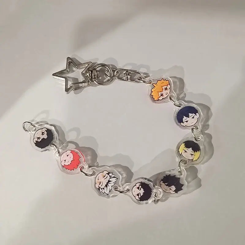 Clear acrylic anime charm bracelet keychain with colorful character charms and silver beaded star pendant clasp