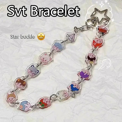 Clear acrylic anime charm bracelet keychain with colorful cartoon charms and a beaded star pendant buckle