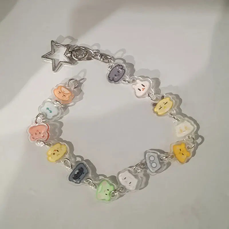 Colorful anime charm bracelet keychain with translucent pastel character pendants and silver beaded star pendant clasp