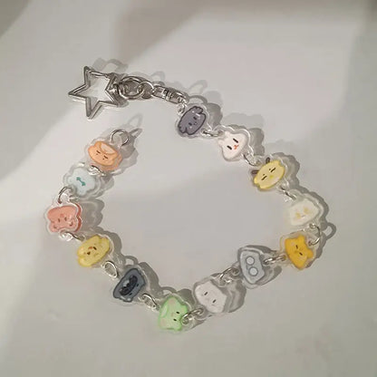 Colorful anime charm bracelet keychain with translucent pastel character pendants and silver beaded star pendant clasp