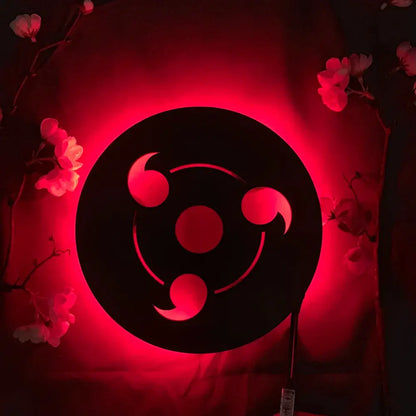 Black circular led wall lamp featuring the red glowing three-ringed sharingan symbol from naruto with remote color-changing light