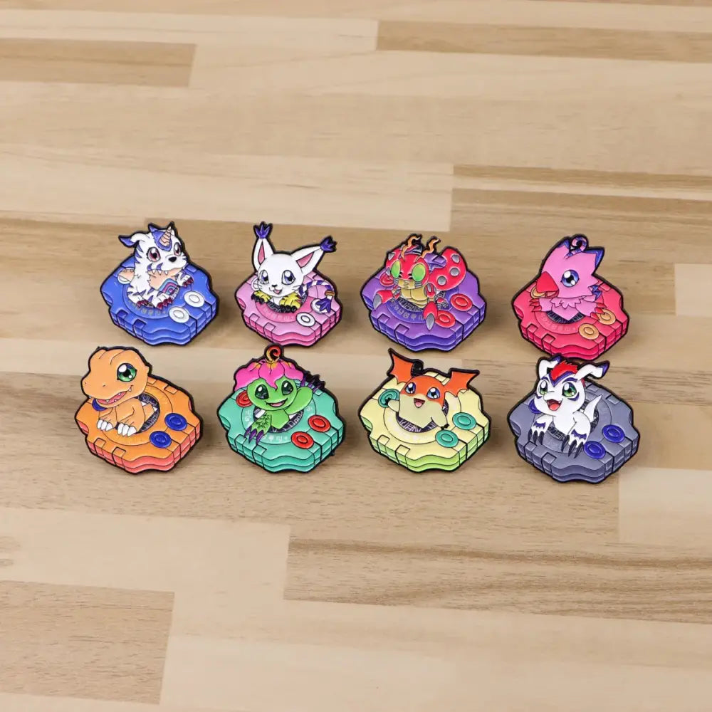 Set of eight colorful glossy enamel pins featuring cute digimon characters on game controller bases anime elf brooch