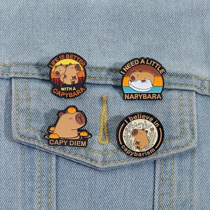 Set of four round anime enamel brooch pins featuring cute capybara designs with colorful backgrounds and funny phrases