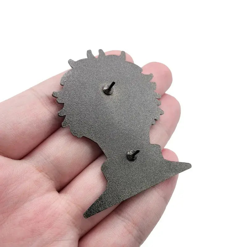 Metallic gray anime enamel pin with stylized spiky hair silhouette perfect as an enamel pin cartoon brooch badge