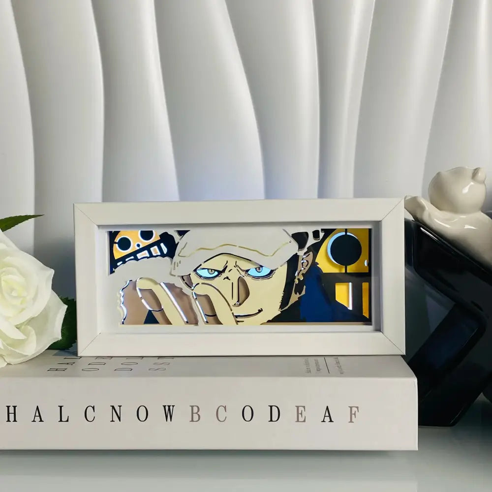 White-framed anime eyes shadow box led lamp featuring blue eyes paper carving with layered cutouts on yellow background