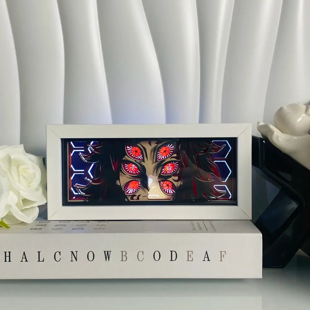 White-framed led light box desk lamp featuring a glowing red-eyed anime eyes 3d paper carving with neon patterns