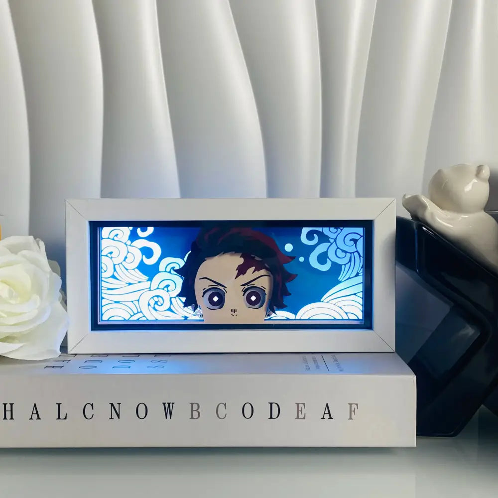 White-framed anime eyes shadow box led lamp with tanjiro kamado face and blue swirling background light box desk lamp