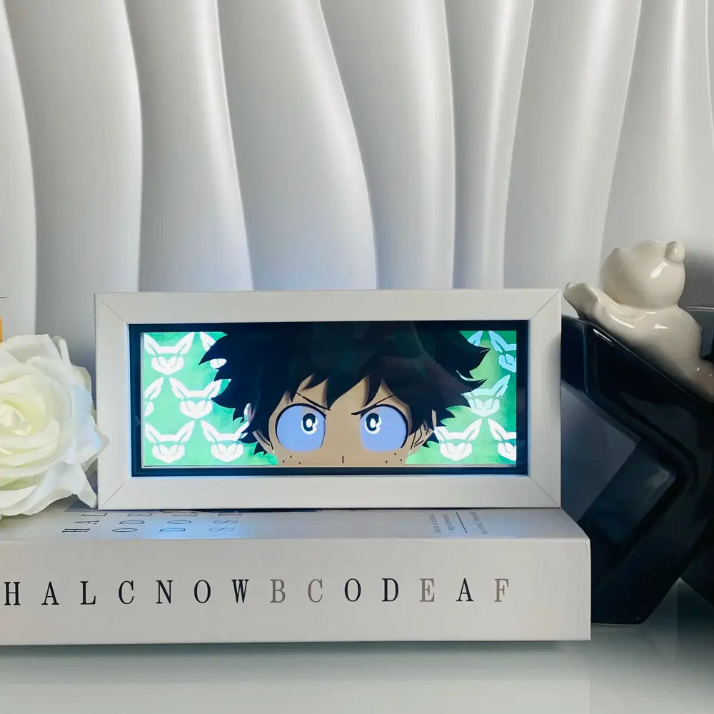 White rectangular led light box desk lamp featuring anime eyes and 3d paper carving of blue eyed character on green fox background