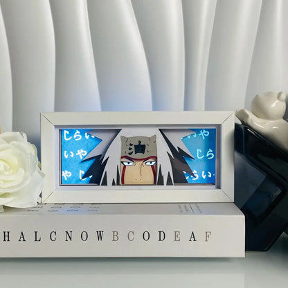 White-framed anime eyes shadow box led lamp with 3d paper carving and blue panels featuring japanese text
