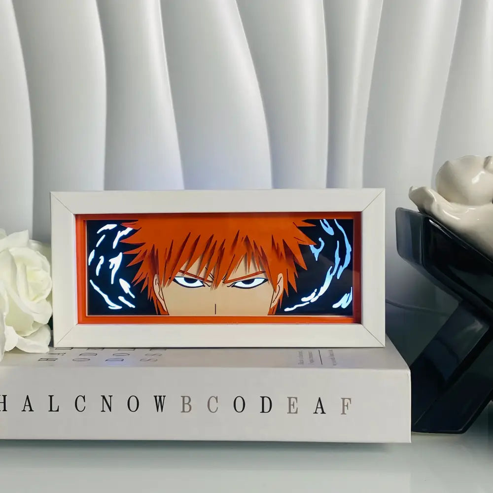 A white-framed anime eyes shadow box led lamp featuring 3d paper carving and glowing blue energy swirls around an orange-haired anime character