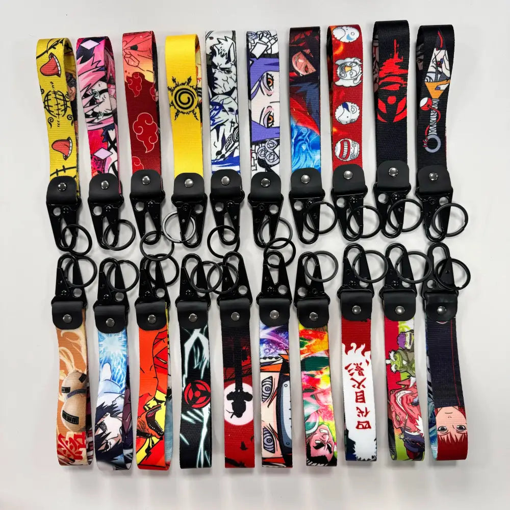 A collection of colorful anime figure eagle wrist straps with black metal keyrings featuring eagle beak clasps