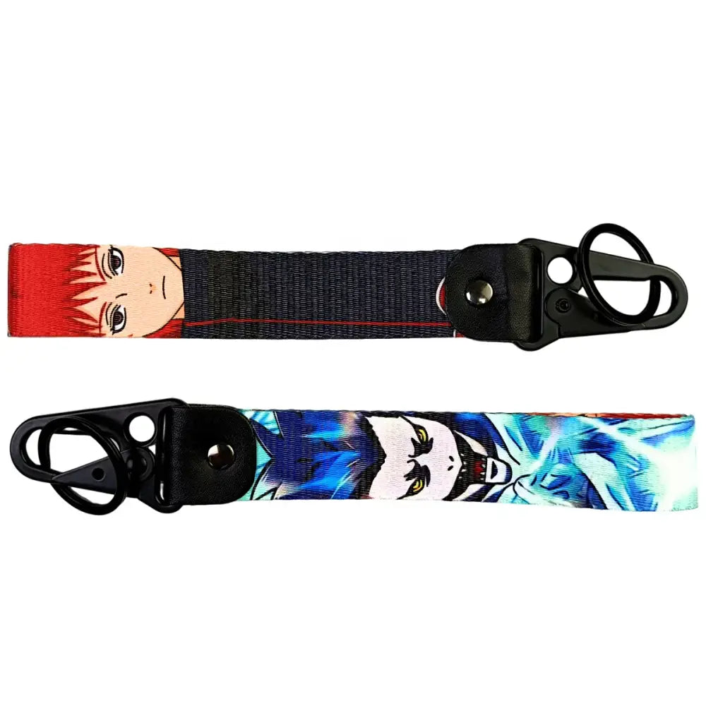 Two anime figure eagle keychains with red and blue characters on metal keyrings featuring eagle beak design