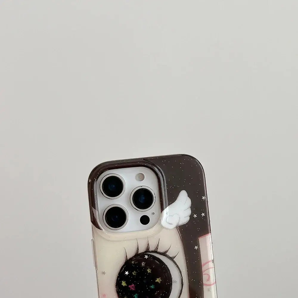 Clear phone case with cartoon eye, glittery stars, and white wings on the back anime girl glittering eyes phone case