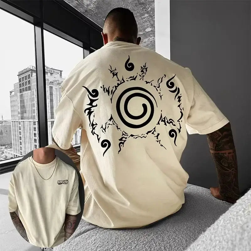 Back view of cream-colored anime graphic oversized t-shirt with bold black spiral emblem on soft cotton short sleeve fabric