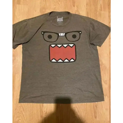Gray heathered cotton y2k anime graphic t-shirt with cartoon character wearing black-rimmed glasses and red mouth