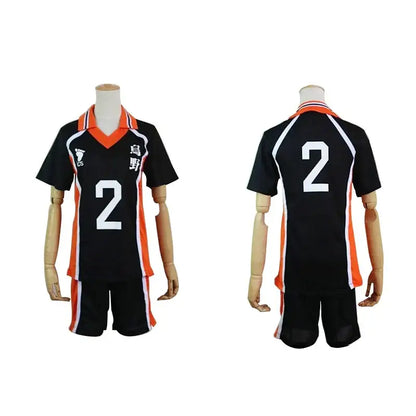 Black and orange nekoma high school volleyball jersey with white number 2 and japanese characters on mannequins