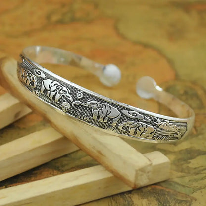 Silver elephant-themed open tibetan silver cuff bracelet with intricate retro carved metal designs