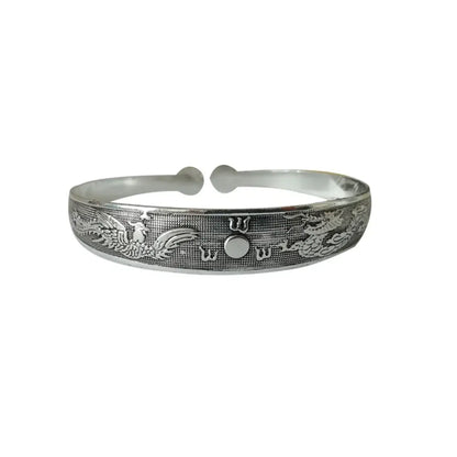Silver dragon and phoenix engraved tibetan silver retro cuff bracelet with central circular motif in metal