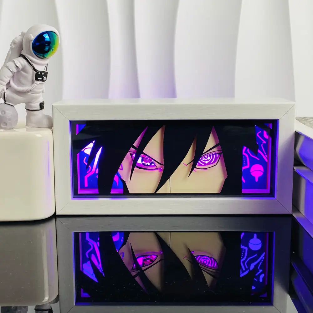 White-framed anime led shadow light box with glowing purple and black character in paper cut wood frame lamp