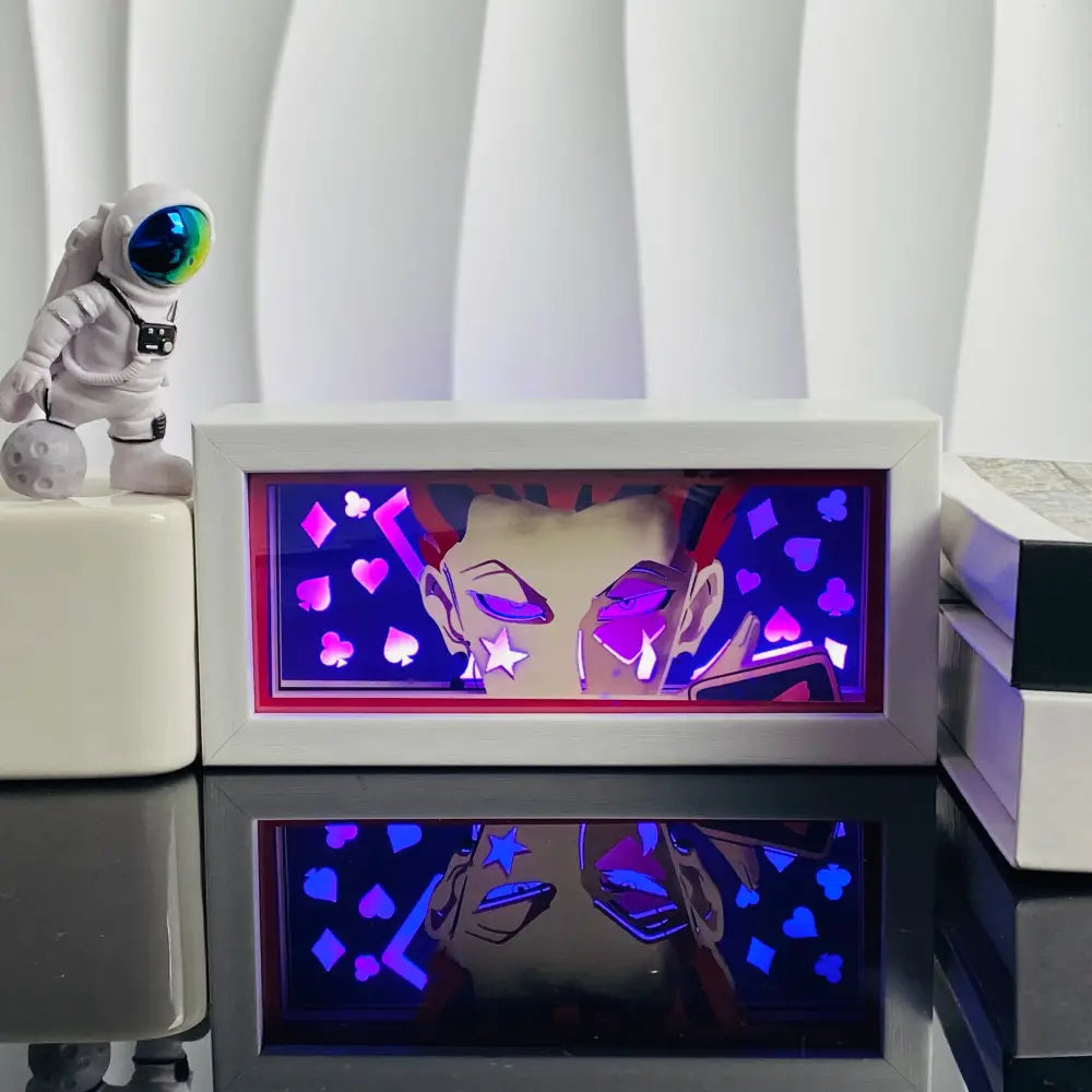 White rectangular anime led shadow light box with glowing purple and pink playing card symbols in paper cut wood frame