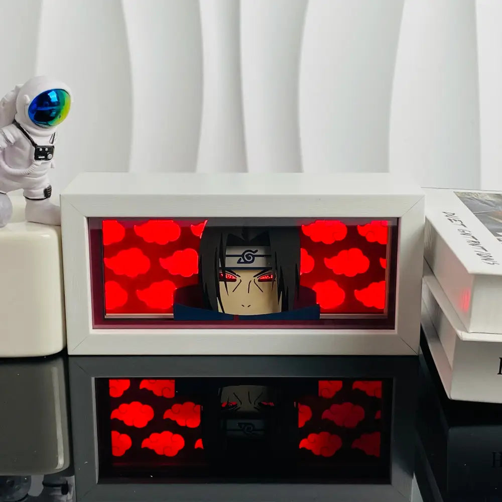 White rectangular anime led shadow light box with glowing red cloud background and illuminated anime face inside wood frame