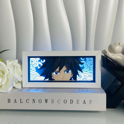 White-framed anime led shadow light box with black hair blue eyes character and glowing blue wave-patterned background