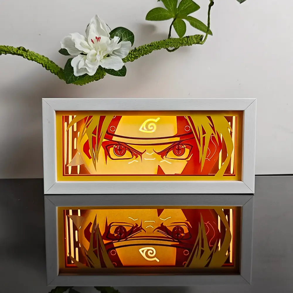 White-framed anime led shadow light box featuring illuminated naruto face with glowing orange and red paper cut wood design