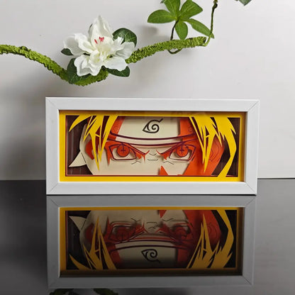 White-framed anime led shadow light box with naruto paper cut art featuring vibrant hair and uzumaki headband symbol