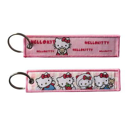 Anime lock keychain featuring a pink embroidered hello kitty keychain with stitched design and metal ring lock keychain