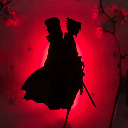 Silhouette of two anime figures with spiky hair on a red cherry blossom background in an anime luminous led wall lamp