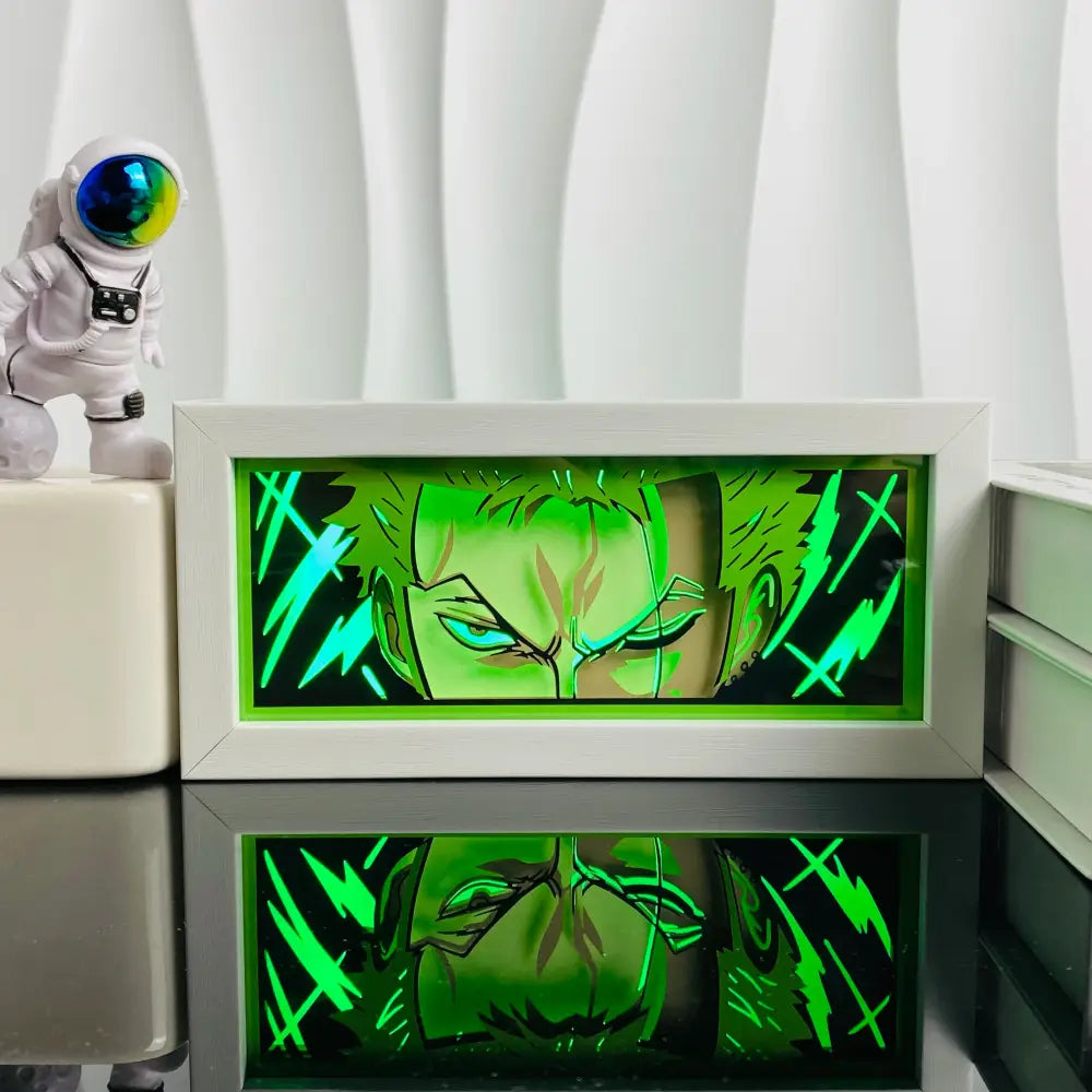 Glowing green illuminated anime character with electric blue eyes in a white frame led paper carving light box shadow lamp