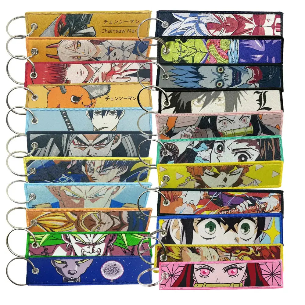 A collection of colorful anime manga badge holder keychains with vibrant designs and metallic usb pendant rings