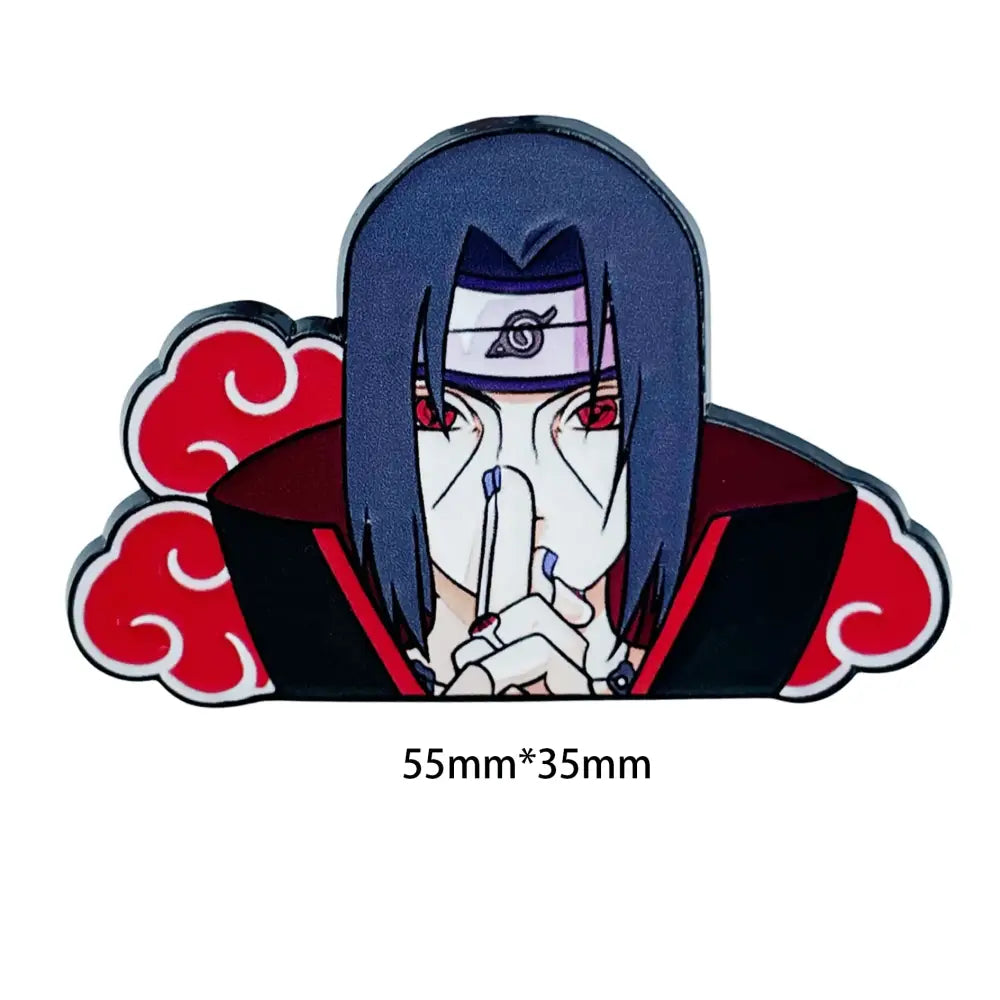Glossy black and red enamel pin featuring itachi uchiha with white mask and red eyes in a manga enamel pin design