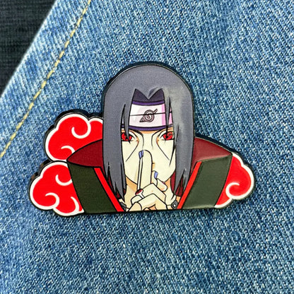 Glossy enamel pin of Itachi Uchiha with gray hair red eyes white headband and Akatsuki cloak red clouds manga enamel pin
