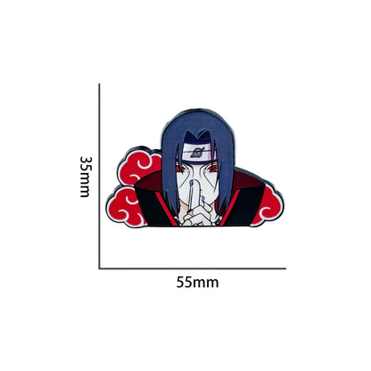 Glossy enamel pin featuring itachi uchiha with dark blue hair and red cloud cloak in stylized manga enamel design