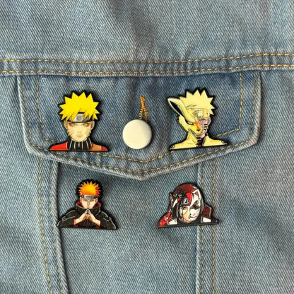 Set of four vibrant naruto manga enamel pins with detailed designs including a white button pin for backpacks