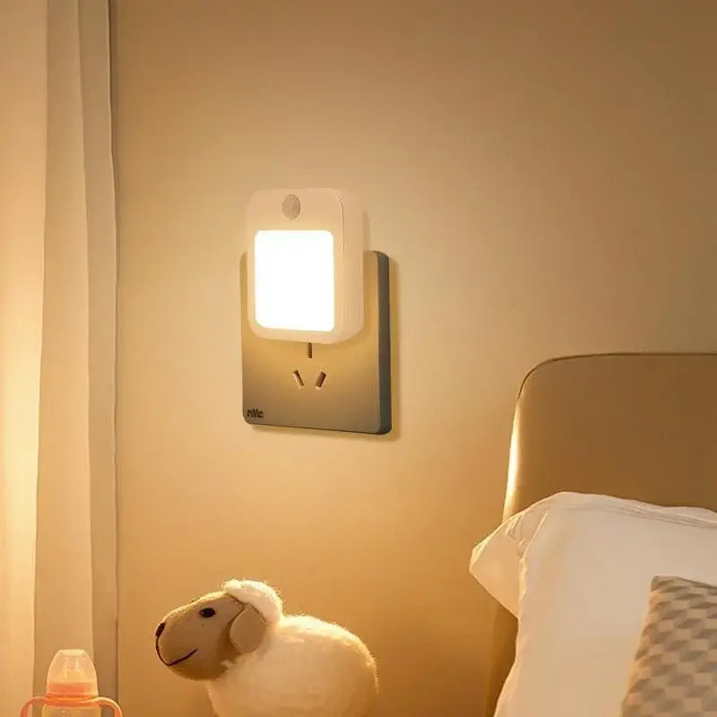 White rectangular anime motion sensor led night light with built-in eu plug mounted on the wall