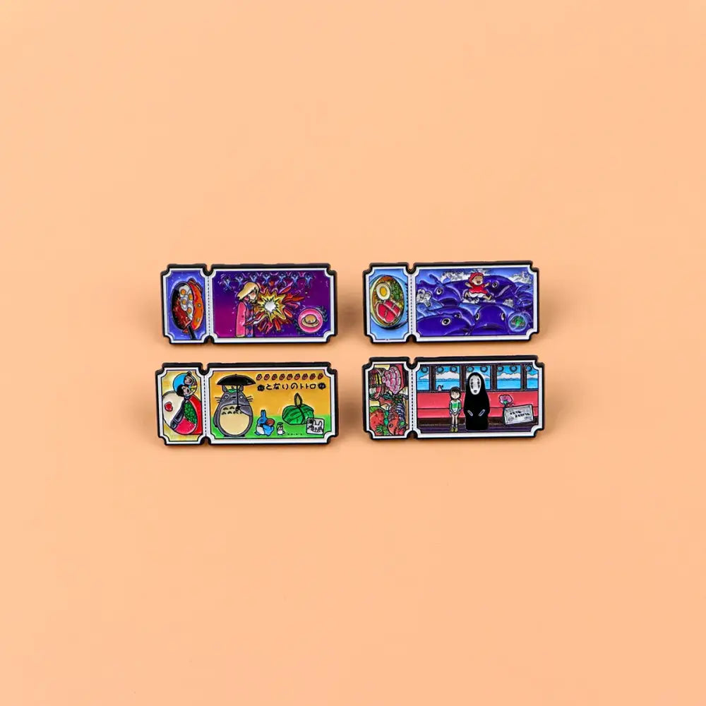 Set of five colorful studio ghibli enamel pins with vibrant artwork and black borders in an anime movie ticket pin set