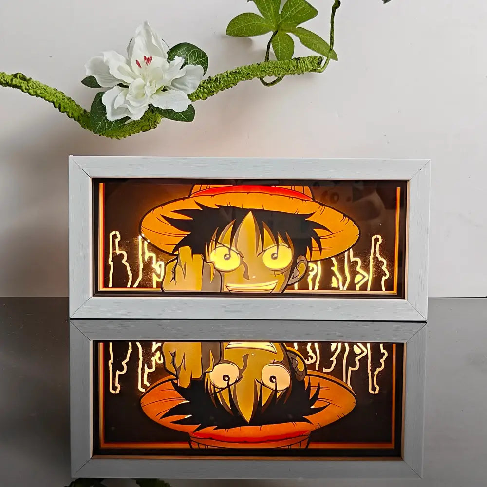 White-framed anime night light box featuring luffy from one piece with glowing yellow eyes and orange hat 3d laser led lamp