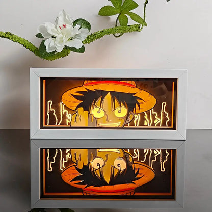 White-framed anime night light box featuring luffy from one piece with glowing yellow eyes and orange hat 3d laser led lamp