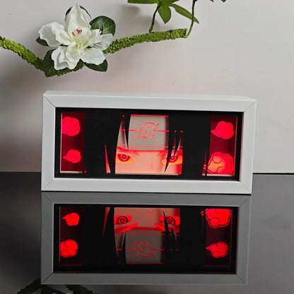 White-framed illuminated naruto uzumaki led night light box with red glowing cloud motifs for table decor