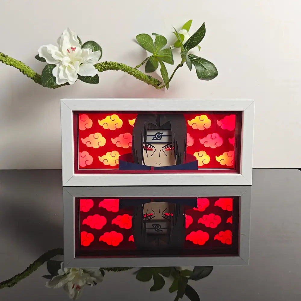 White-framed illuminated naruto uchiha paper-cut led lamp with red orange clouds and 7-color remote control