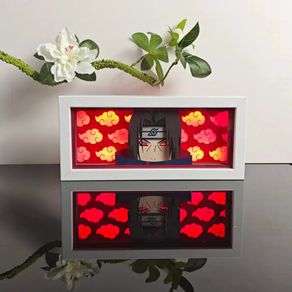 White-framed illuminated naruto uchiha paper-cut led lamp with red orange clouds and 7-color remote control