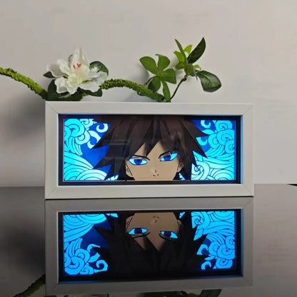 White-framed anime paper-cut led lamp with blue-lit portrait and remote control featuring swirling cloud patterns