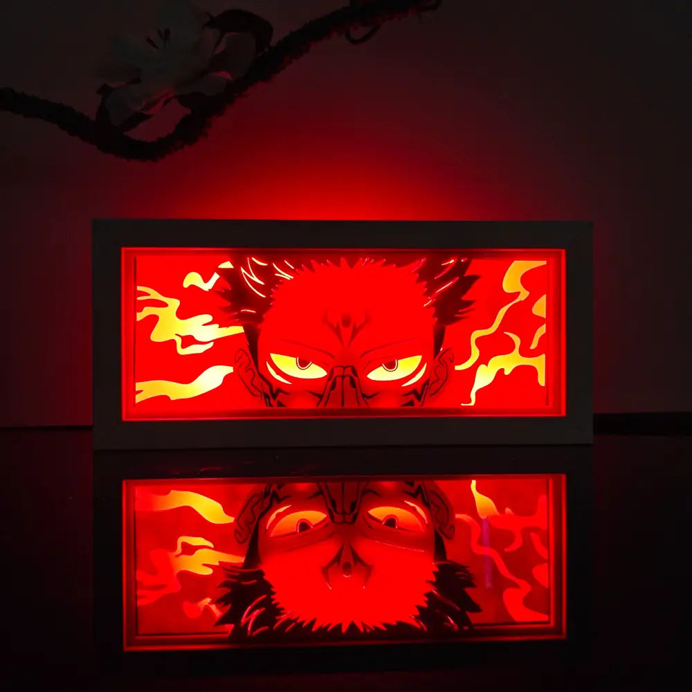 Red and yellow illuminated anime paper-cut led lamp featuring a stylized demonic face with remote control and glowing eyes